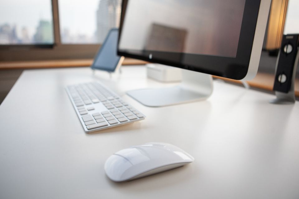 Clean workspace with computer used for planning an engagement budget